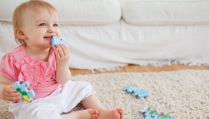 infant playing with puzzle